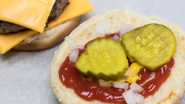 bun with ketchup and pickles