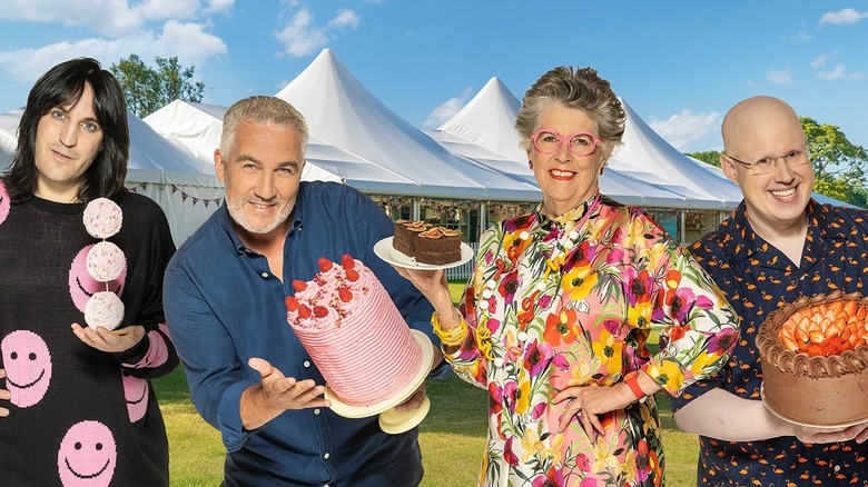 "The Great British Bake Off" hosts and judges holding cakes