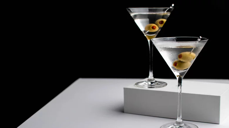 Two martinis with olives