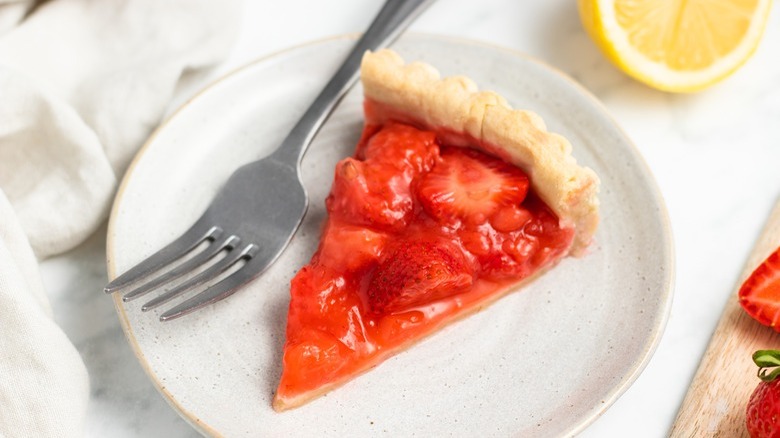 strawberry pie on white plate