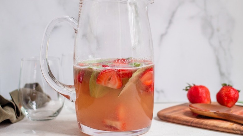 strawberry drink in glass pitcher