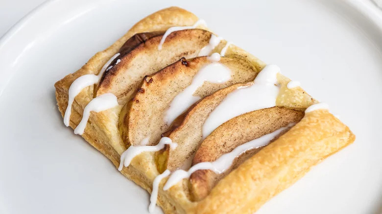 cinnamon apple pastries with a drizzle of icing