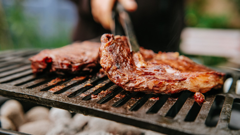 cooking steaks on the grill