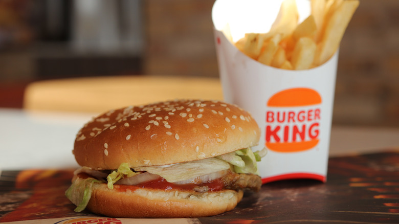 Whopper Jr. and fries on table