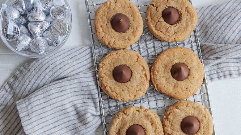 six peanut butter cookies on a wire rack