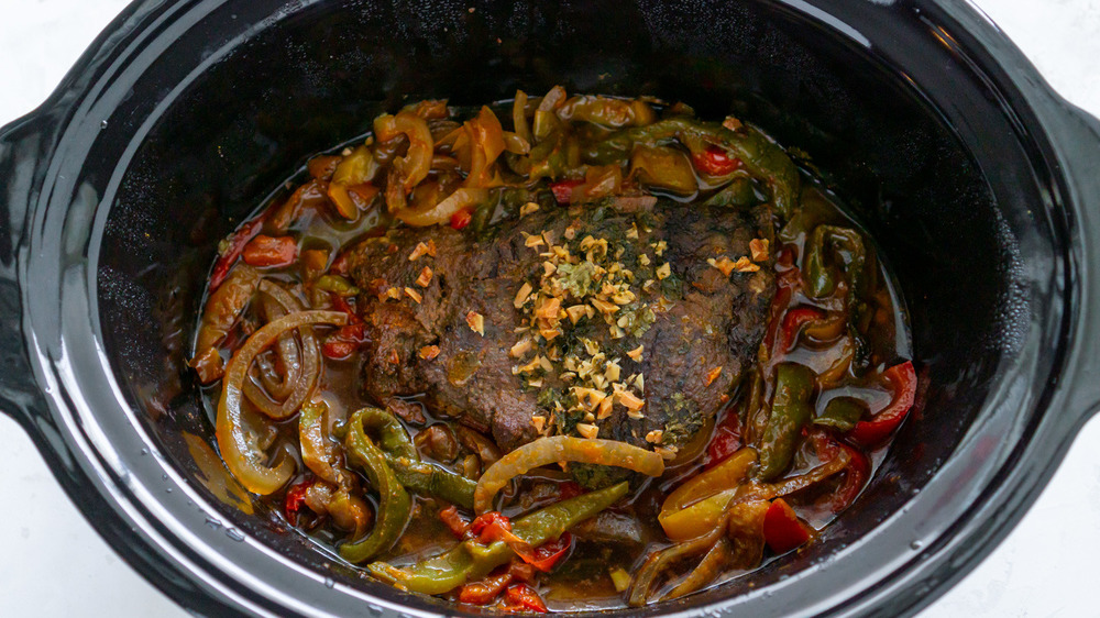 onions, peppers and steak in slow cooker
