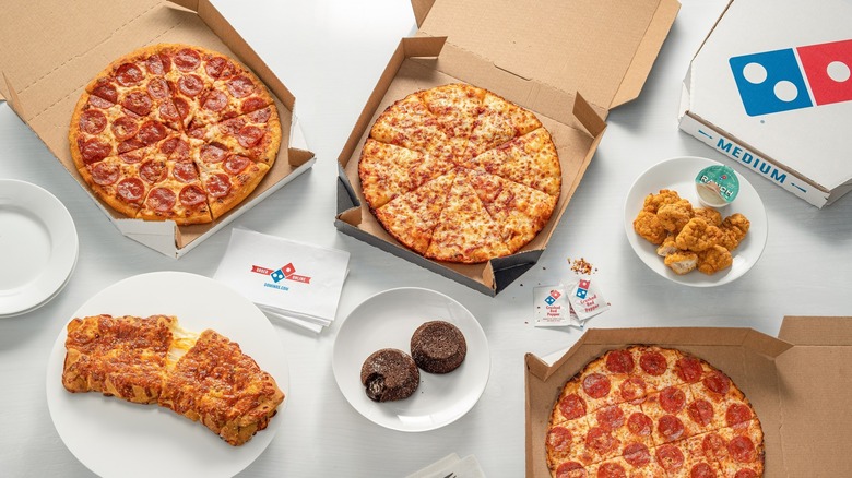 Domino's pizza boxes showing off the logo