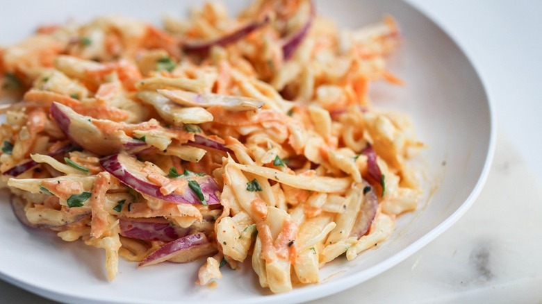 creamy coleslaw on white plate