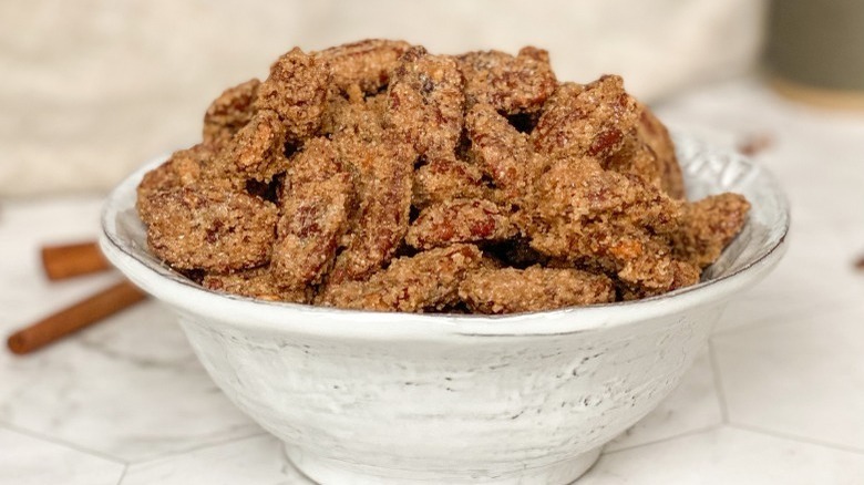 sugared pecans in white bowl