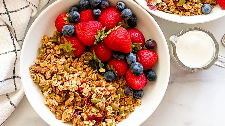 Bowl of granola with fresh, whole berries. 