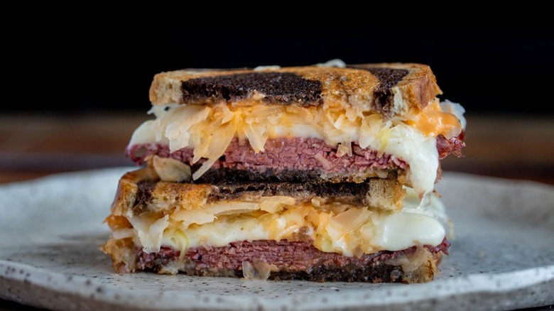 reuben sandwich on gray plate