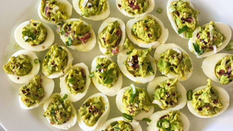 deviled eggs with guacamole filling