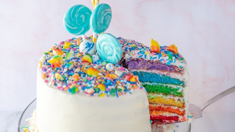 rainbow-striped cake on plate