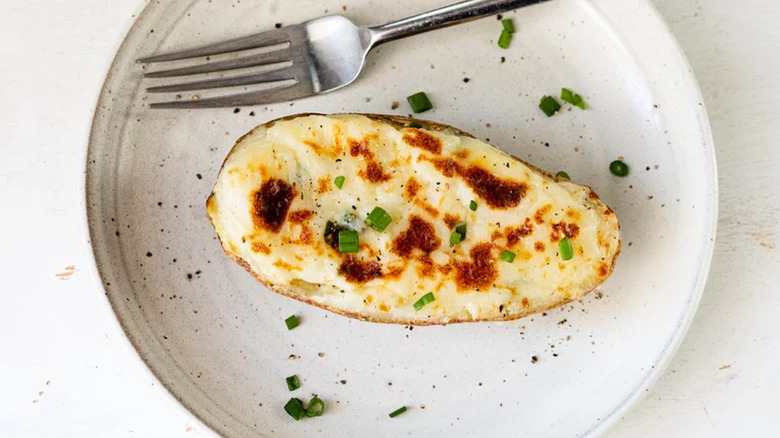 twice baked potato with fork