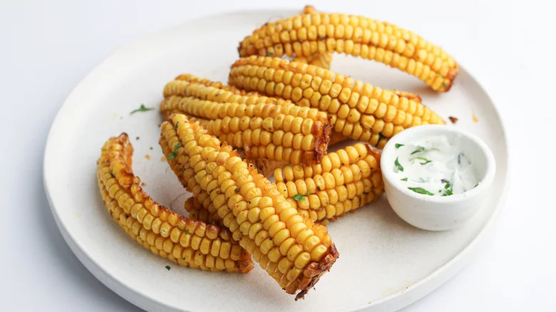 Cooked corn snacks with dip