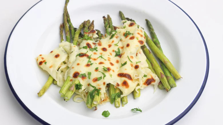 Asparagus with melted cooked cheese