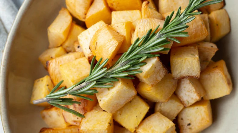 Rosemary sprig on roasted rutabaga