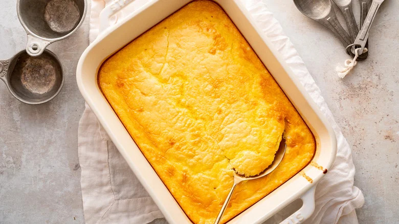 Serving spoon in corn pudding