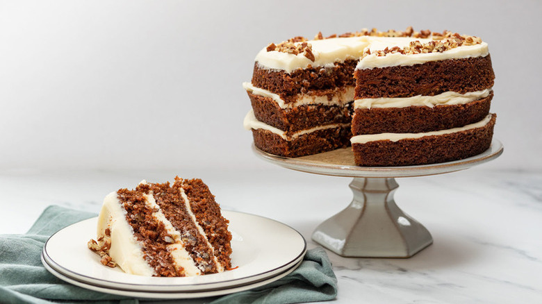 cake stand and plate with carrot cake