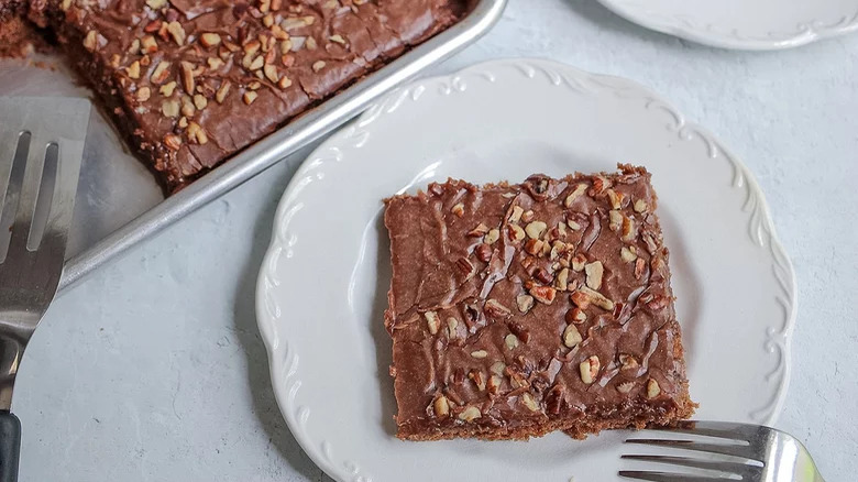 baking sheet and plate with texas sheet cake and fork