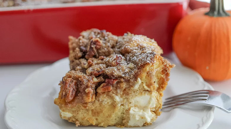 slice of pumpkin spice baked french toast on plate with fork