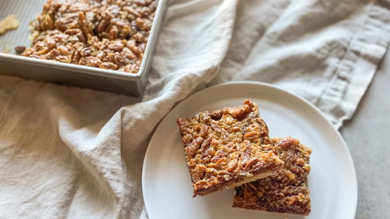 baking pan and plate with pecan pie bars