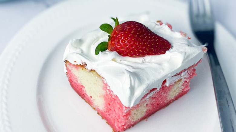 strawberry poke cake on plate