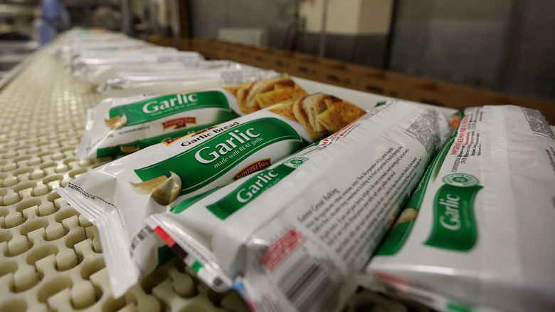 frozen garlic bread on a conveyor belt