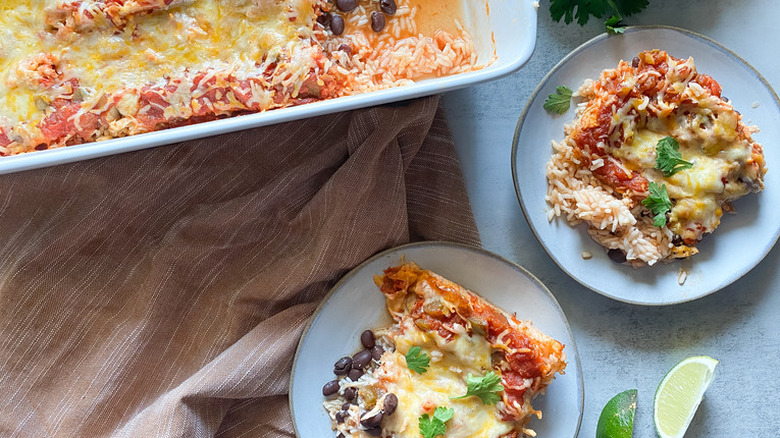 Baked chicken and cheese casserole in pan and on plates.