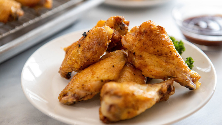 Baked chicken wings on plate