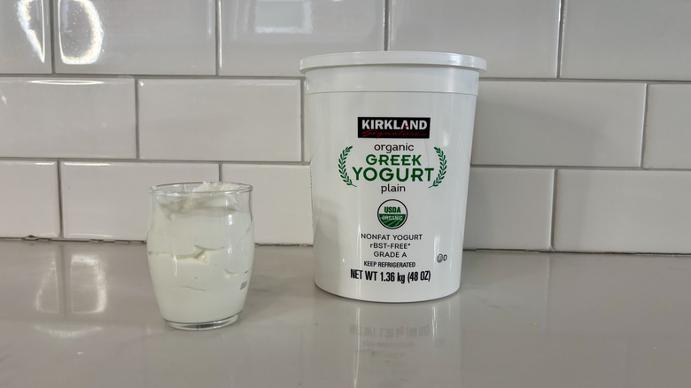 Container of plain Greek yogurt