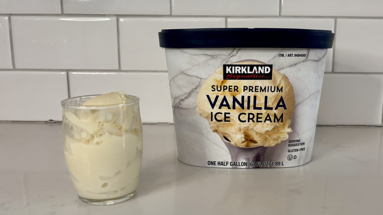 Vanilla ice cream in carton and glass