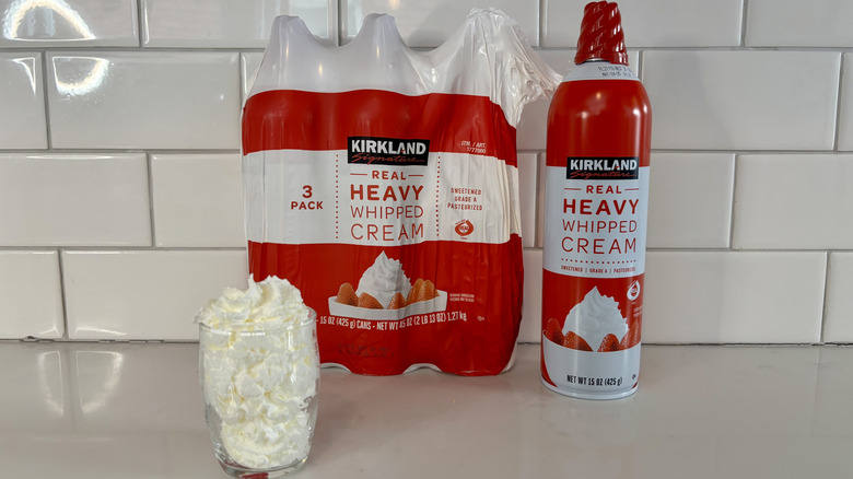 Three cans of whipped cream