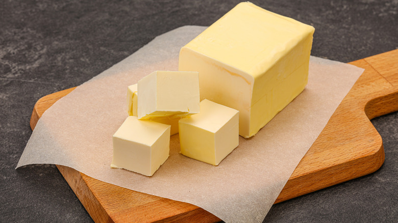 Yellow butter slabs on cutting board