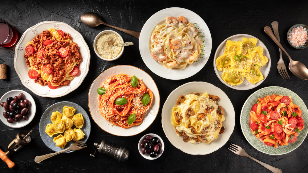 Plates of pasta dishes on a table