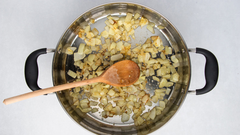 onion frying in a pan