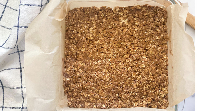 Raw granola mix in baking dish