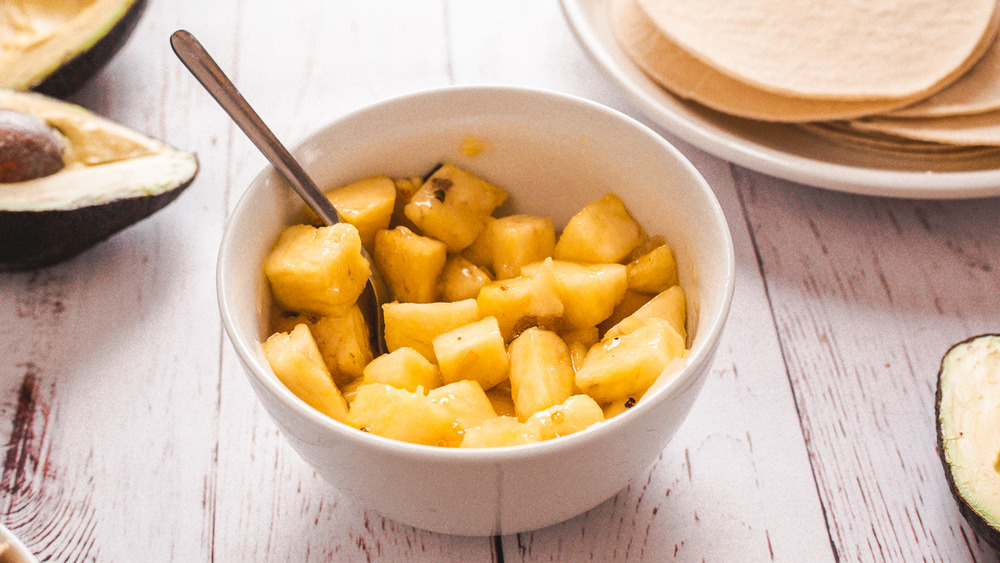 bowl of diced pineapple with sauce