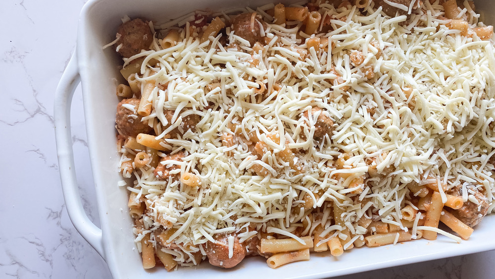 5-ingredient meatball pasta bake ingredients placed in pan