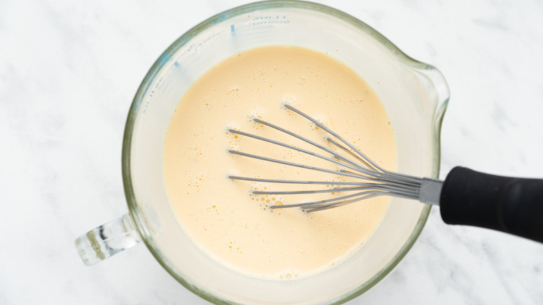 whisking eggs in bowl 