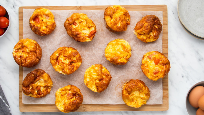 mini quiches on cutting board 