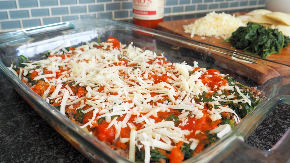 layering lasagna for 5-ingredient spinach and ravioli lasagna