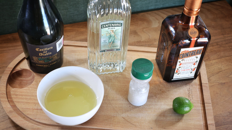 champagne margarita ingredients on cutting board