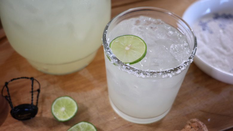 champagne margarita with salted rim and lime wheel garnish