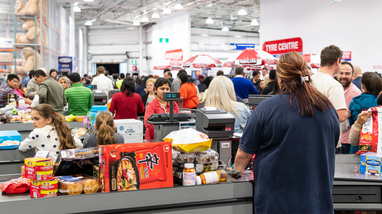 crowd of people at the Costco checkout lanes