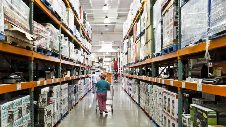 costco customer walking down aisle