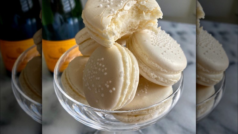 champagne flavored macarons in a bowl