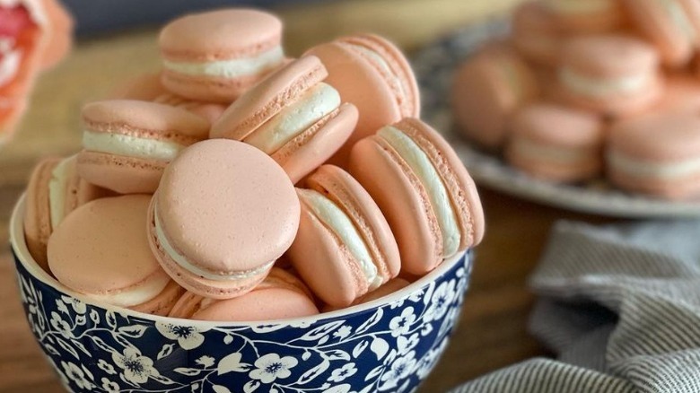 guava flavored macarons in bowl