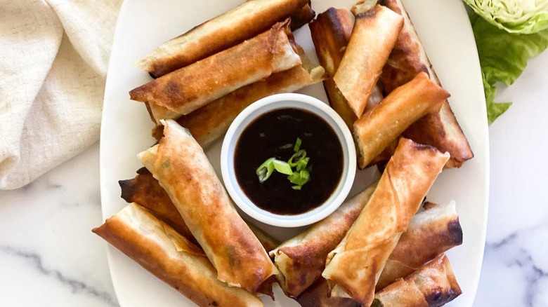 lumpia on white platter