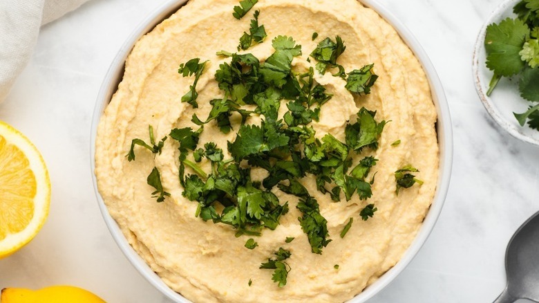 bowl of hummus with cilantro